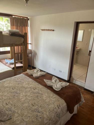 Una cama o camas en una habitación de Harmony Inn Miraflores