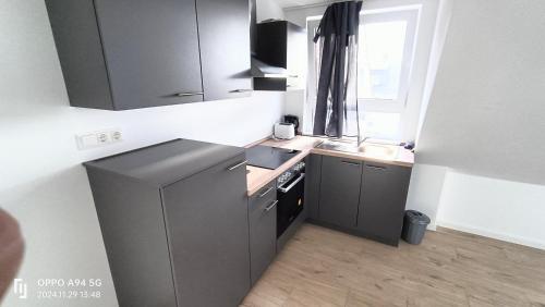 Kuchyň nebo kuchyňský kout v ubytování FMI28 Deluxe Studio-Apartments