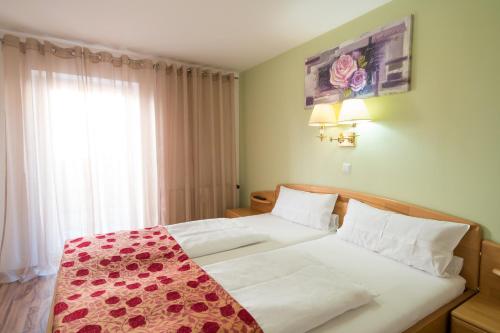 Ένα ή περισσότερα κρεβάτια σε δωμάτιο στο Wellnesshotel & Restaurant Hexenschopf