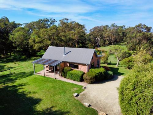 an aerial view of a house with a solar roof at Prom Coast Holiday Lodge in Waratah Bay