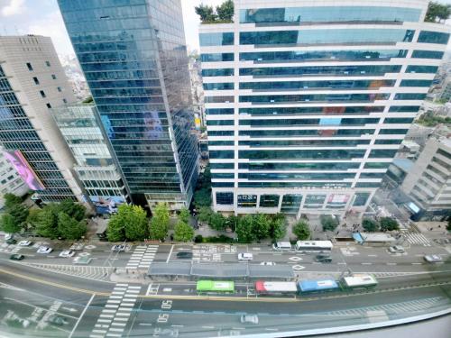 an aerial view of a city street with tall buildings at Hongdae Residence-2 1min from Hongik Uni station Exit #1 in Seoul