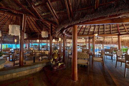 a restaurant with a person sitting in the middle of the room at JW Marriott Cancun Resort & Spa in Cancún
