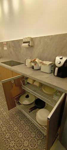 a counter top with toilets sitting on a shelf at RHR Deluxe GuestHouse Kinarut Papar Sabah - Island View in Kampong Limputang