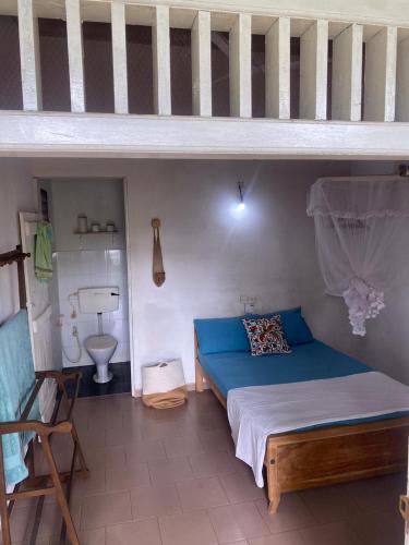 a bedroom with a bunk bed and a blue bed at riVer in Pelena
