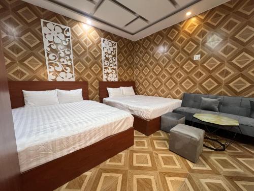 Ένα ή περισσότερα κρεβάτια σε δωμάτιο στο LÉ BOISE HOTEL Đà Lạt
