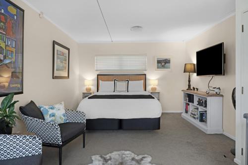 En eller flere senge i et værelse på Sutherlands by the Sea