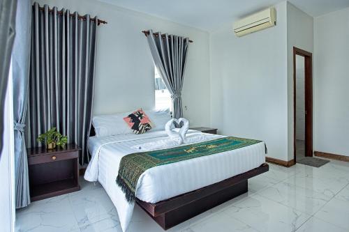 Katil atau katil-katil dalam bilik di Kong Kea Angkor Villa