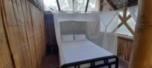 Jui Chi MaMa Ecolodge & Birdingにあるベッド