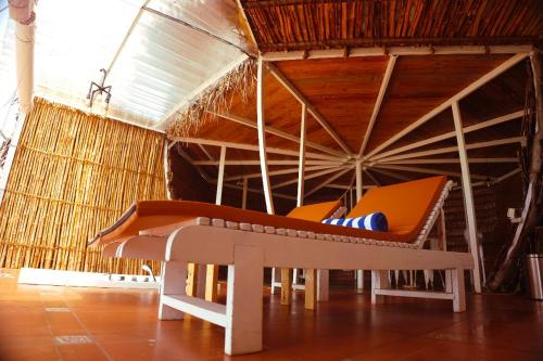 a bed in a room with at Nest By Craftels, Goa in Cola