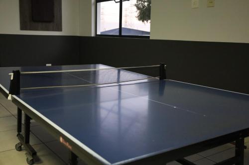 a ping pong table in a room with at LM company in Edendale