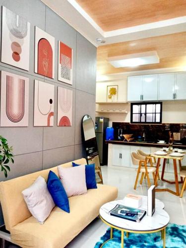 a living room with a couch and a table at FYLL Homes Francheska Suite Calvario St Cavinti Town Proper in Cavinti