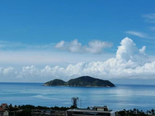 a view of an island in the ocean at Hainan Peninsula Sunshine Seaview Apartment Shenzhou Peninsula Branch in Wanning