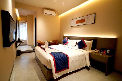 Ένα ή περισσότερα κρεβάτια σε δωμάτιο στο Zip By Spree Hotels Nanded