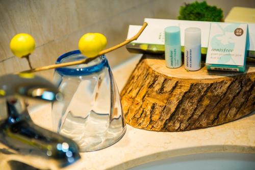 a bathroom counter with a sink and a counter top with a sink at Xizhengjia Apartment Hotel Pazhou Complex in Guangzhou