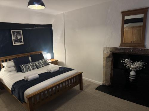 Postel nebo postele na pokoji v ubytování Little Priory Cottage