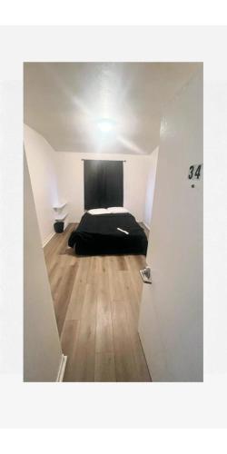 a view of a bedroom with a bed in a room at Van Nuys Downtown Paradise in Los Angeles