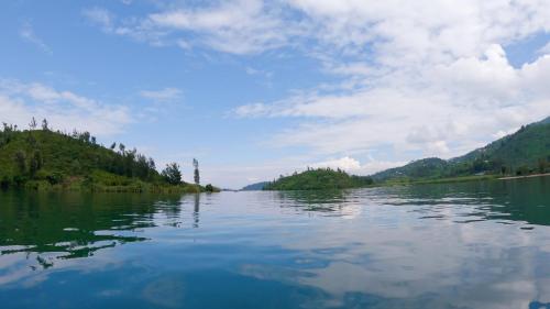 a view of a lake with trees on the shore at Umutuzo Lodge Kivu Lake in Buhoro