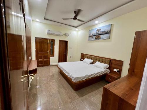 a bedroom with a bed and a shower in it at Om Kashi Villa in Varanasi