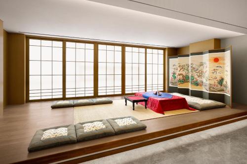 a room with a table and some large windows at Courtyard by Marriott Sejong in Sejong