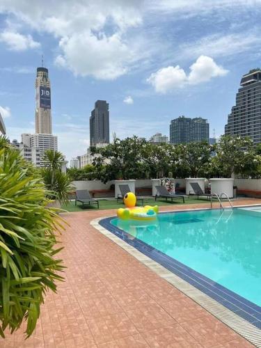 a large swimming pool with a inflatable at Apartment studio at platinum in Bangkok