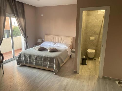 Postel nebo postele na pokoji v ubytování Meri Rooms