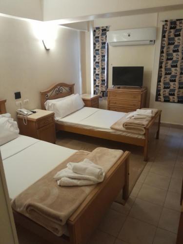 Postel nebo postele na pokoji v ubytování Applicators Hotel