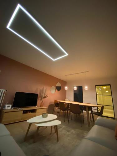 a living room with a couch and a dining table at A&S Sea Vieuw 1 in Blankenberge