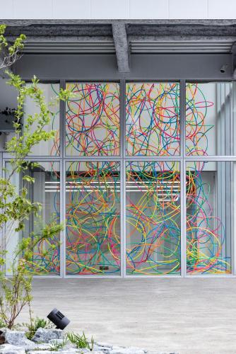 a painting on the side of a building at まえばしガレリアArt residence & Hotel in Maebashi