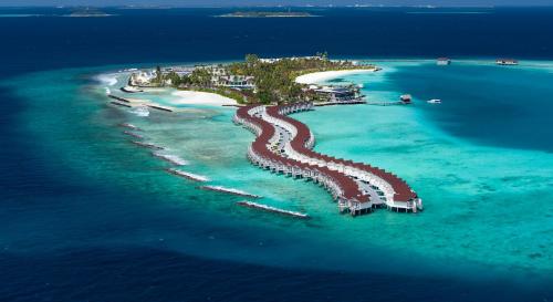an island with a resort in the water at OBLU XPERIENCE Ailafushi - All Inclusive with Free Transfers in Male City