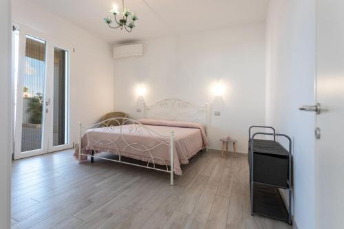 Кровать или кровати в номере villa Alba chiara sul mare