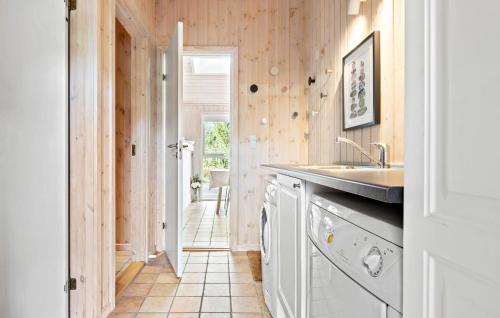 a kitchen with a sink and a dishwasher at Gorgeous Home In Ålbæk With Sauna in Ålbæk