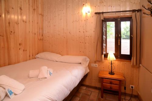 Katil atau katil-katil dalam bilik di Camping Reina Isabel