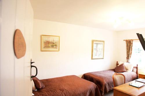 Ένα ή περισσότερα κρεβάτια σε δωμάτιο στο Sheephouse Manor