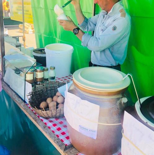 a man standing next to a table with eggs on it at La Maison Gavraise in Gavray