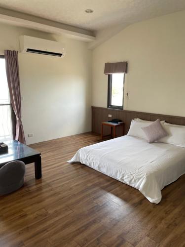 Postel nebo postele na pokoji v ubytování Landay Homestay