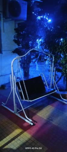 a metal object on a stage with blue lights at Humdum Holiday Homes 1 in Neral