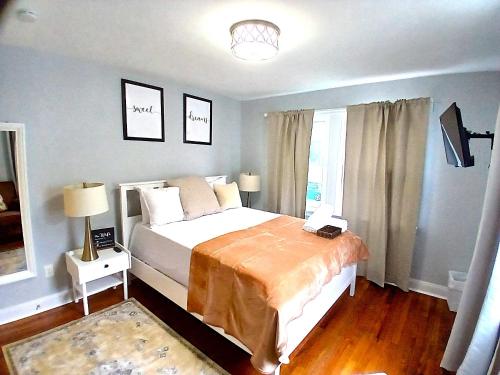a bedroom with a large bed and a window at Luxury & Merry Private Room in DC in Washington, D.C.
