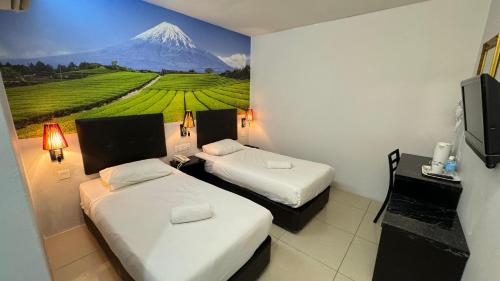 Ένα ή περισσότερα κρεβάτια σε δωμάτιο στο Best View Hotel Sunway Mentari