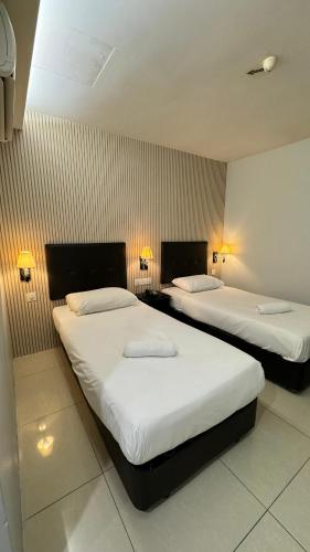 Ένα ή περισσότερα κρεβάτια σε δωμάτιο στο Best View Hotel Sunway Mentari