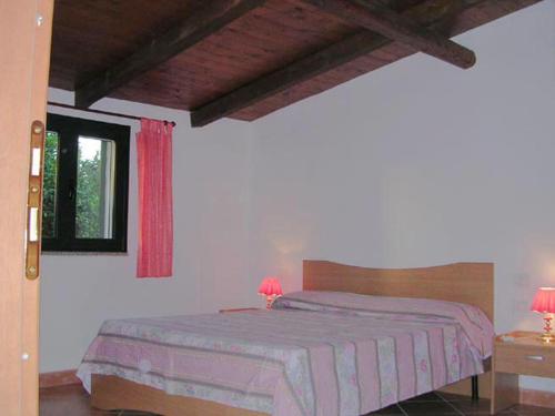 Katil atau katil-katil dalam bilik di Appartamento villa delle Arance 300mt dalla spiaggia