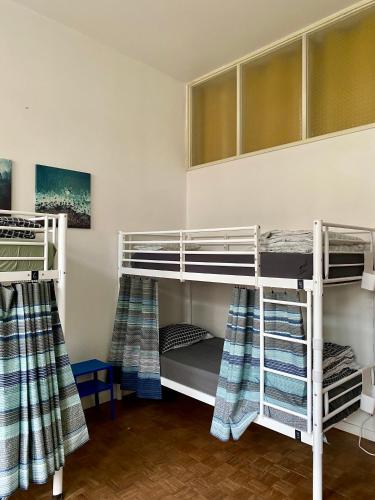 a room with two bunk beds in a room at Barão 35 Guest House in Braga