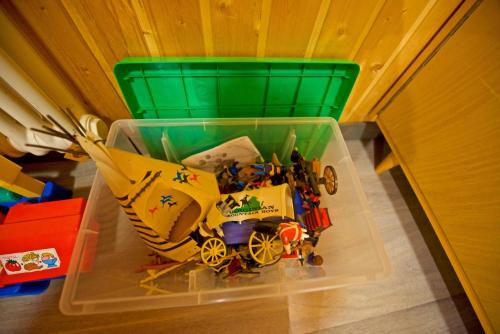 a plastic container with toys in it on a table at L'observatoire des Alpes, les Crosets in Val-d'Illiez