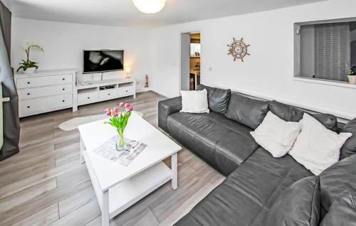 a living room with a couch and a table at Ferienwohnung Graal-Müritz in Graal-Müritz