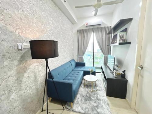 a living room with a blue couch and a table at PJ 2 Room ID home design 1-8 pax 5 min to One U in Petaling Jaya