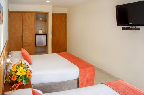 Hotel Be La Sierraにあるテレビまたはエンターテインメントセンター
