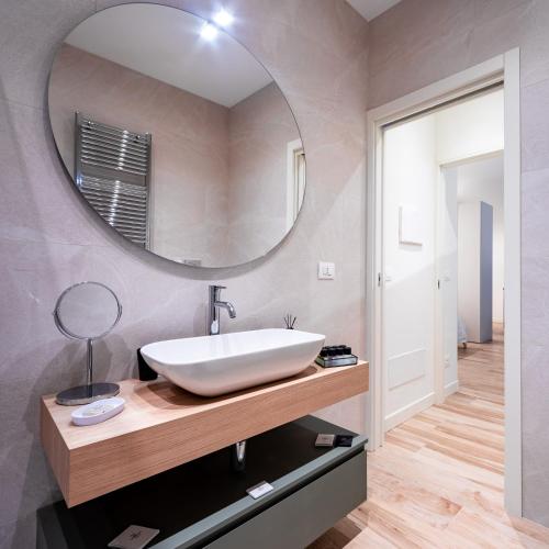 a bathroom with a sink and a mirror at Love Suite Verona in Verona