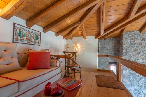 a living room with a couch and a table at Winter Breeze in Arachova