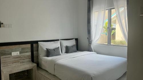 Katil atau katil-katil dalam bilik di DVilla Guesthouse Langkawi