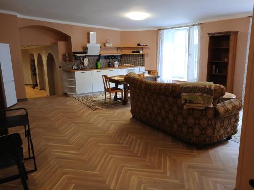 a living room with a couch and a kitchen at Parlament in Tallinn