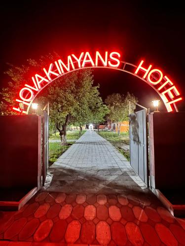 an open gate with a sign that reads yawnans house at Hovakimyans Garden And Pool in Zvartnots International Airport